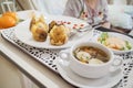 Female patient having lack of appetite regardless varied and delicious meal on the table Royalty Free Stock Photo