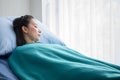 female patient in hospital bed . young woman laying down in ward . alone Royalty Free Stock Photo