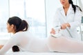 Beautiful brunette woman getting LPG massage for lifting body in LPG suit Royalty Free Stock Photo