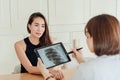 A female patient is listening to the doctor explain after an x-ray Royalty Free Stock Photo