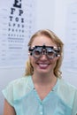 Female patient looking through messbrille during eye examination
