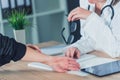 Female patient at orthopedic doctor medical exam for wrist injur Royalty Free Stock Photo