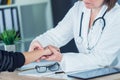 Female patient at orthopedic doctor medical exam for wrist injur Royalty Free Stock Photo