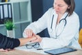 Female patient at orthopedic doctor medical exam for wrist injur Royalty Free Stock Photo