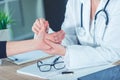 Female patient at orthopedic doctor medical exam for wrist injur Royalty Free Stock Photo