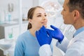 Positive nice woman looking at her dentist Royalty Free Stock Photo
