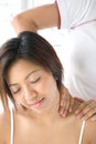 Female patient receiving shoulder massage Royalty Free Stock Photo