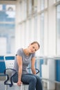 Female patient, sitting in a wheelchair for patients