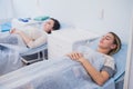 Female patient sleeping in medical bed at the hospital ward Royalty Free Stock Photo