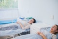 Female patient sleeping in medical bed at the hospital ward Royalty Free Stock Photo