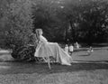 Female patient in wheelchair relaxing in garden Royalty Free Stock Photo