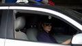 Female patrolwoman driving police car, traffic laws patrolling, monitoring order Royalty Free Stock Photo