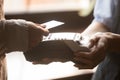 Female paying with credit card use NFC technology closeup hands Royalty Free Stock Photo