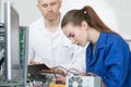 Female pc technician next to teacher Royalty Free Stock Photo