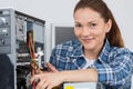 Female pc technician posing next to disassembled desktop computer Royalty Free Stock Photo