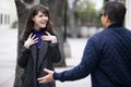 Woman Running Into a Friend on the Street By Coincidence