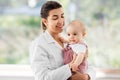 Female pediatrician doctor with baby at clinic Royalty Free Stock Photo