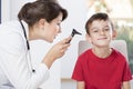 Female pediatrician using otoscope Royalty Free Stock Photo