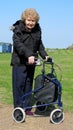 Female pensioner with delta walking aid Royalty Free Stock Photo