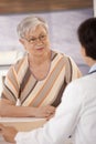 Female pensioner at doctors office