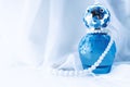 Female perfume on a light background with pearl beads Royalty Free Stock Photo