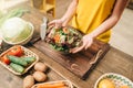 Female person cooking salad, healthy organic food Royalty Free Stock Photo