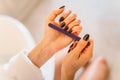 Female person hands with nail file, manicure