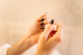 Female person hands with nail polish closeup