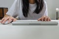 Female person holding mouse and keyboard computer. Technology internet information browsing online social media and network Royalty Free Stock Photo