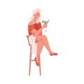 Woman drinking cocktail on barstool