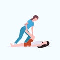 Female personal trainer doing stretching exercises with girl fitness instructor helping woman to stretch muscles workout Royalty Free Stock Photo
