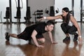 Female personal trainer working with her trainee Royalty Free Stock Photo