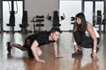 Female personal trainer working with her trainee Royalty Free Stock Photo