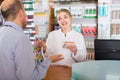 Pharmacist counseling customer Royalty Free Stock Photo
