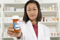 Female Pharmacist Holding Prescription Drugs Royalty Free Stock Photo