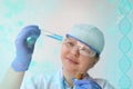 Female pharmacist, scientist holding a glass test tube with medicine, vaccine, modern science innovation concept, medical