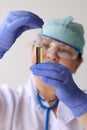 Female pharmacist, scientist holding a test tube with medicine, vaccine, concept of innovation in modern science, medical