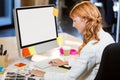 Female photo editor working at computer desk