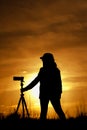 Female photographer with camera at sunsetlight Royalty Free Stock Photo