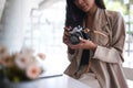 A female photographer checking photos in camera while sitting at her studio. Royalty Free Stock Photo