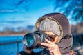 Female photographer dressed with winter clothes taking images of Central Park in New York City Royalty Free Stock Photo