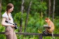 Female photographer and proboscis monkey