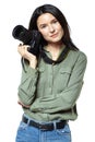 Female photographer reporter in jeans and a khaki shirt posing with a camera. Isolated on white