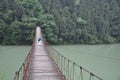 Female photographer and Rope Bridge