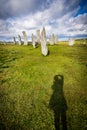 Photographer`s shadow in the grass in front of Callanish Standing Stones Royalty Free Stock Photo