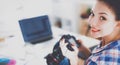 Female photographer sitting on the desk with laptop