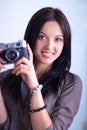 Female photographer sitting on the desk with laptop Royalty Free Stock Photo