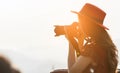 Female Photographer at sunrise in the mountains Royalty Free Stock Photo