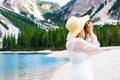 Female photographer taking pictures of Dolomites near Lake Braies Royalty Free Stock Photo