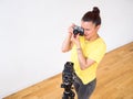 A female photographer using a vintage rangefinder 35mm film camera. Royalty Free Stock Photo